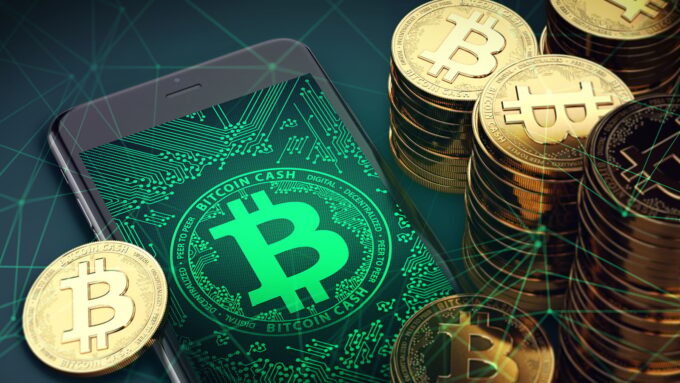 Bitcoin on mobile with bitcoin background