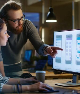 Female UX Architect Has Discussion with Male Design Engineer, Th