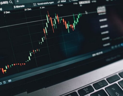 A laptop with a graph on the screen